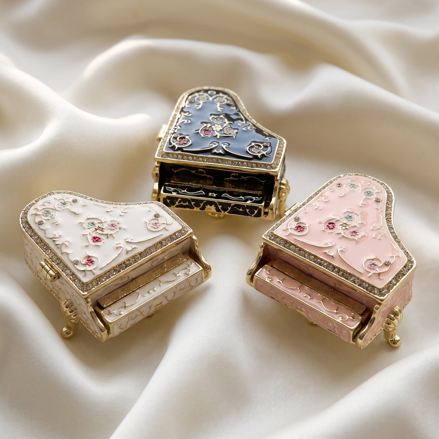 Black white and pink floral grand piano jewellery boxes on satin