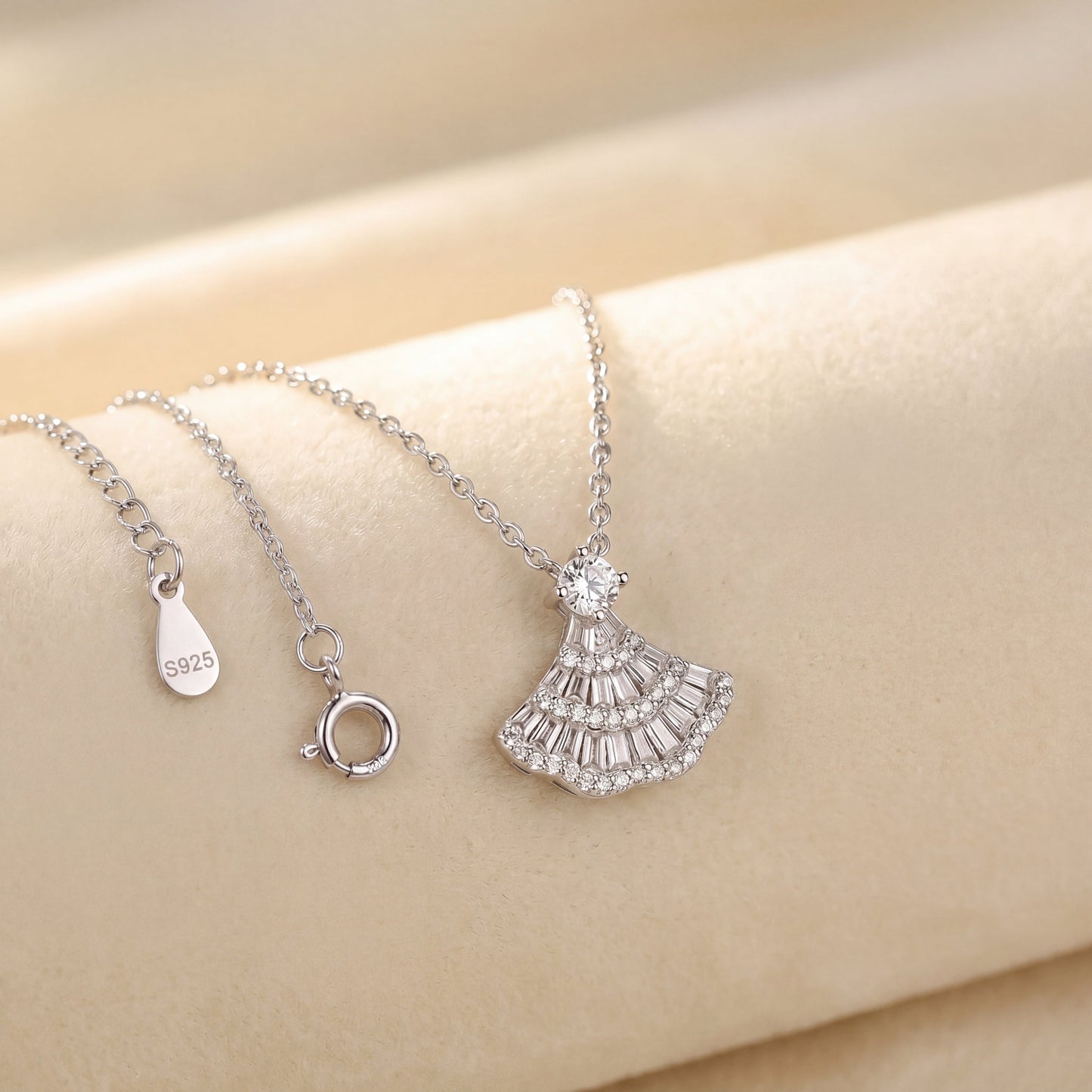 Close up of 925 sterling silver vintage fan pendant necklace with sparkling fan shaped pendant and adjustable chain