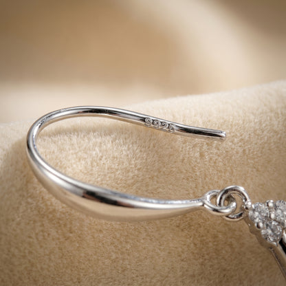 Close up of 925 sterling silver ear hook detail on teardrop dancing earrings