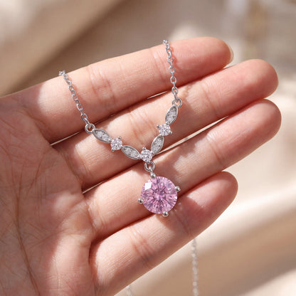 925 sterling silver floral vine necklace shown on hand with pink cubic zirconia pendant