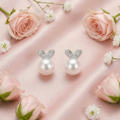 925 sterling silver pearl bunny stud earrings styled with soft pink flowers