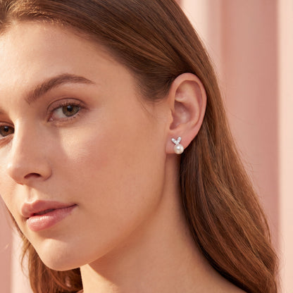 Model wearing 925 sterling silver pearl bunny stud earrings, cute pearl earrings for women and girls