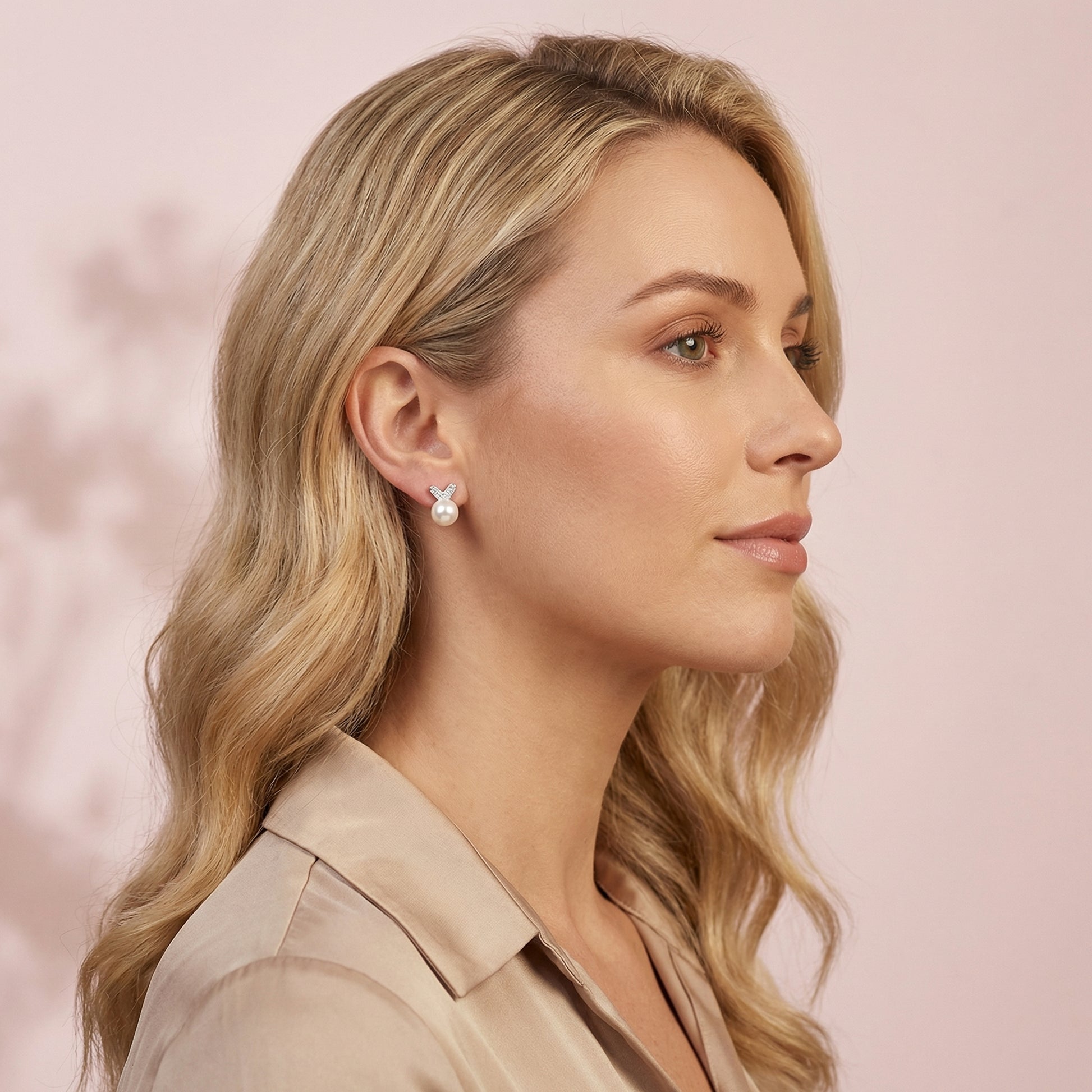 Model wearing 925 sterling silver pearl bunny stud earrings