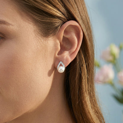 Close-up ear view of 925 sterling silver pearl teardrop stud earrings
