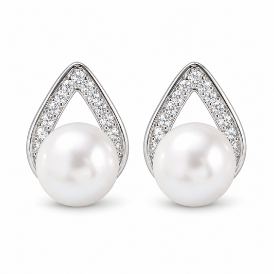 A pair of teardrop-shaped pearl stud earrings with silver pavé accents, shown on a clean white background.