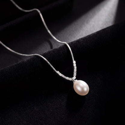 925 sterling silver teardrop pearl pendant necklace photographed on black fabric background