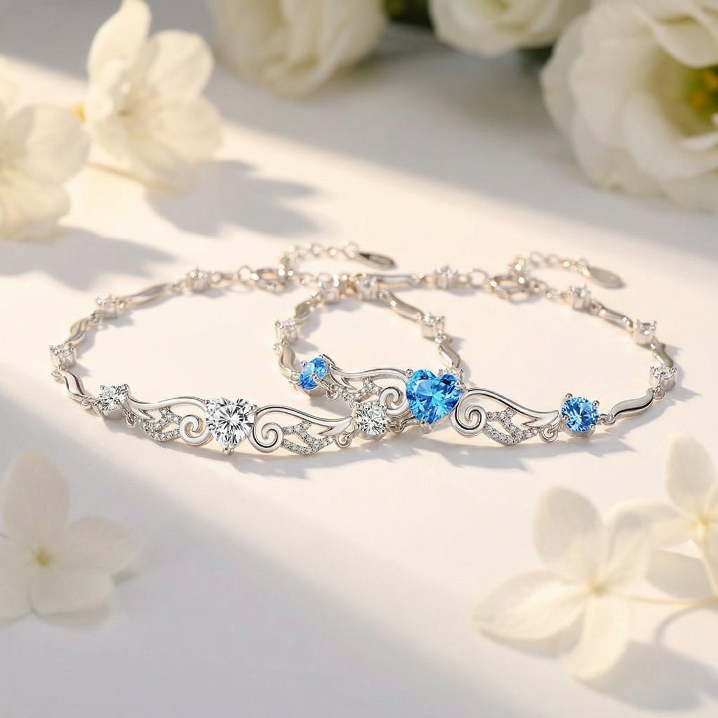 Angel Wings 925 sterling silver heart bracelet in blue and clear crystal styles displayed together
