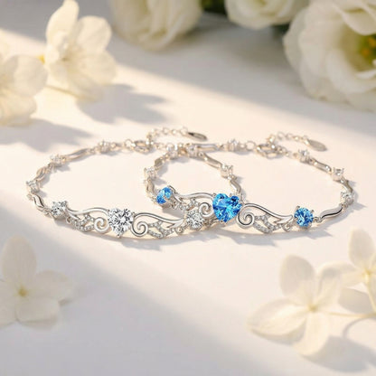 Angel Wings 925 sterling silver heart bracelet in blue and clear crystal styles displayed together
