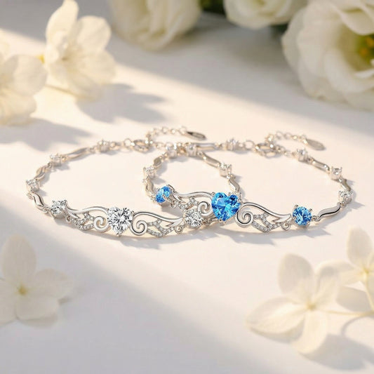 Angel Wings 925 sterling silver heart bracelet in blue and clear crystal styles displayed together