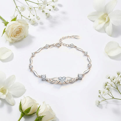 Angel Wings 925 sterling silver heart bracelet with clear crystal heart in elegant flat lay styling