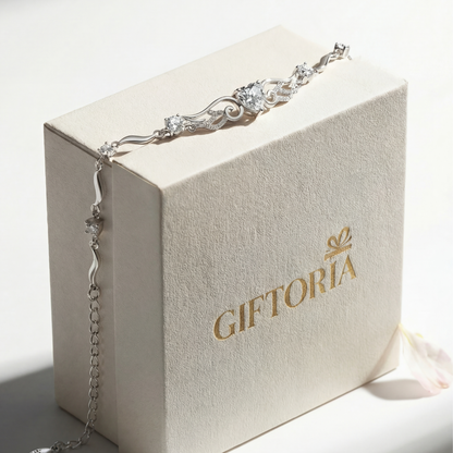 Angel wings heart sterling silver bracelet displayed with Giftoria jewellery gift packaging