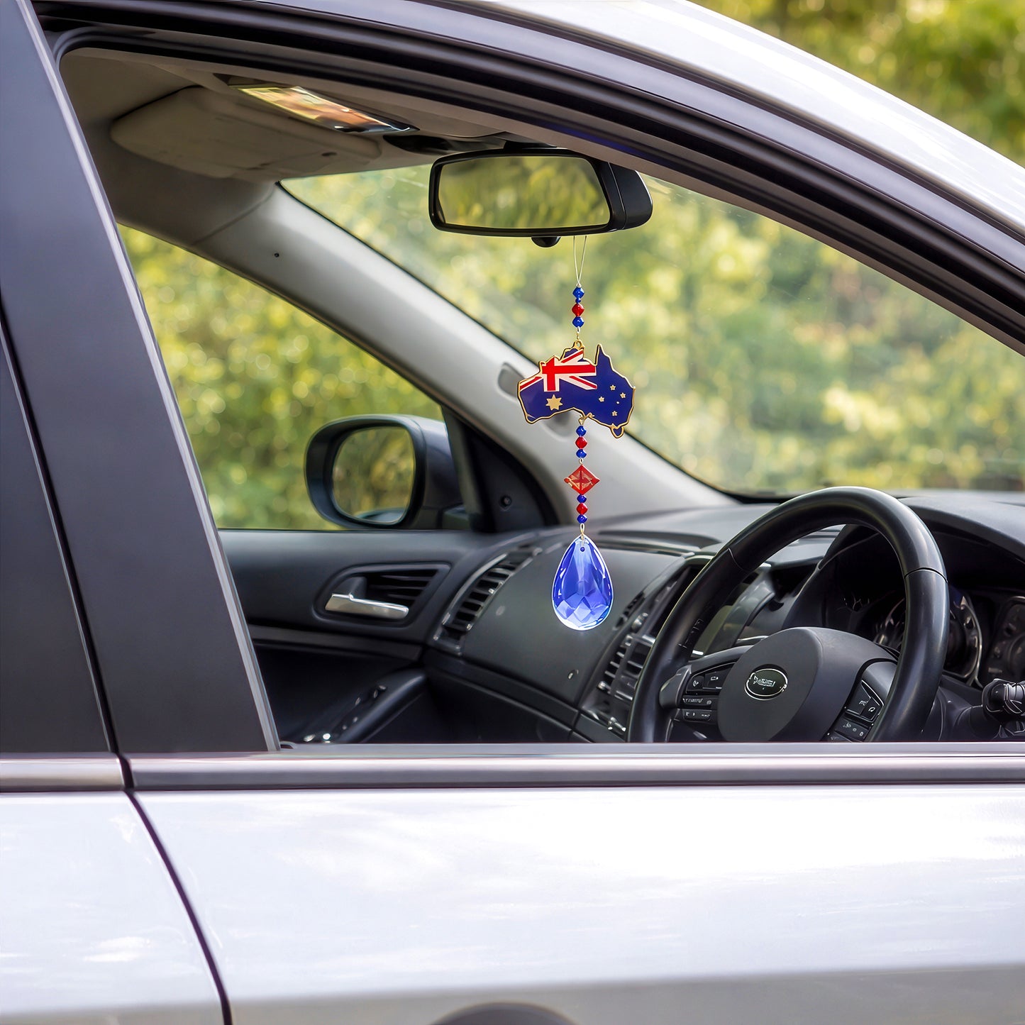 Australia crystal sun catcher hanging from car mirror, adding colour while driving