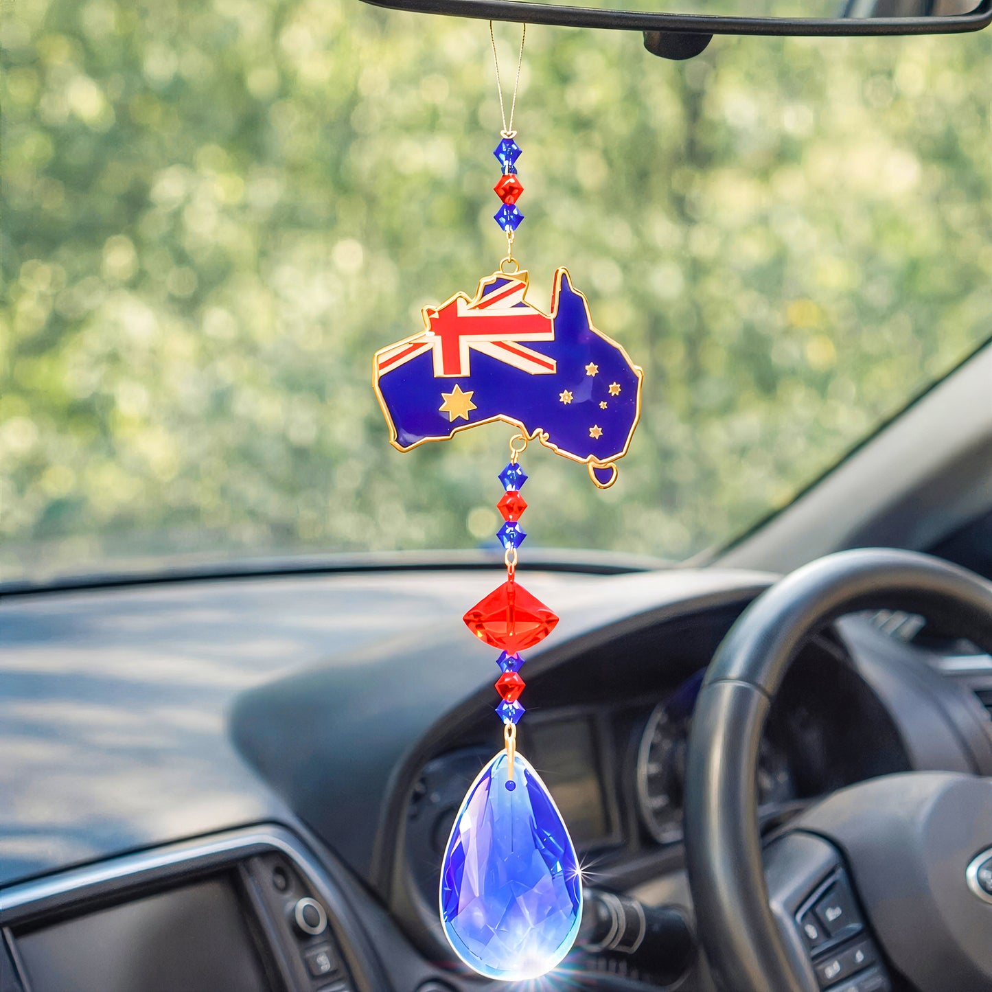 Australia map sun catcher detail inside car with crystal beads and blue glass pendant