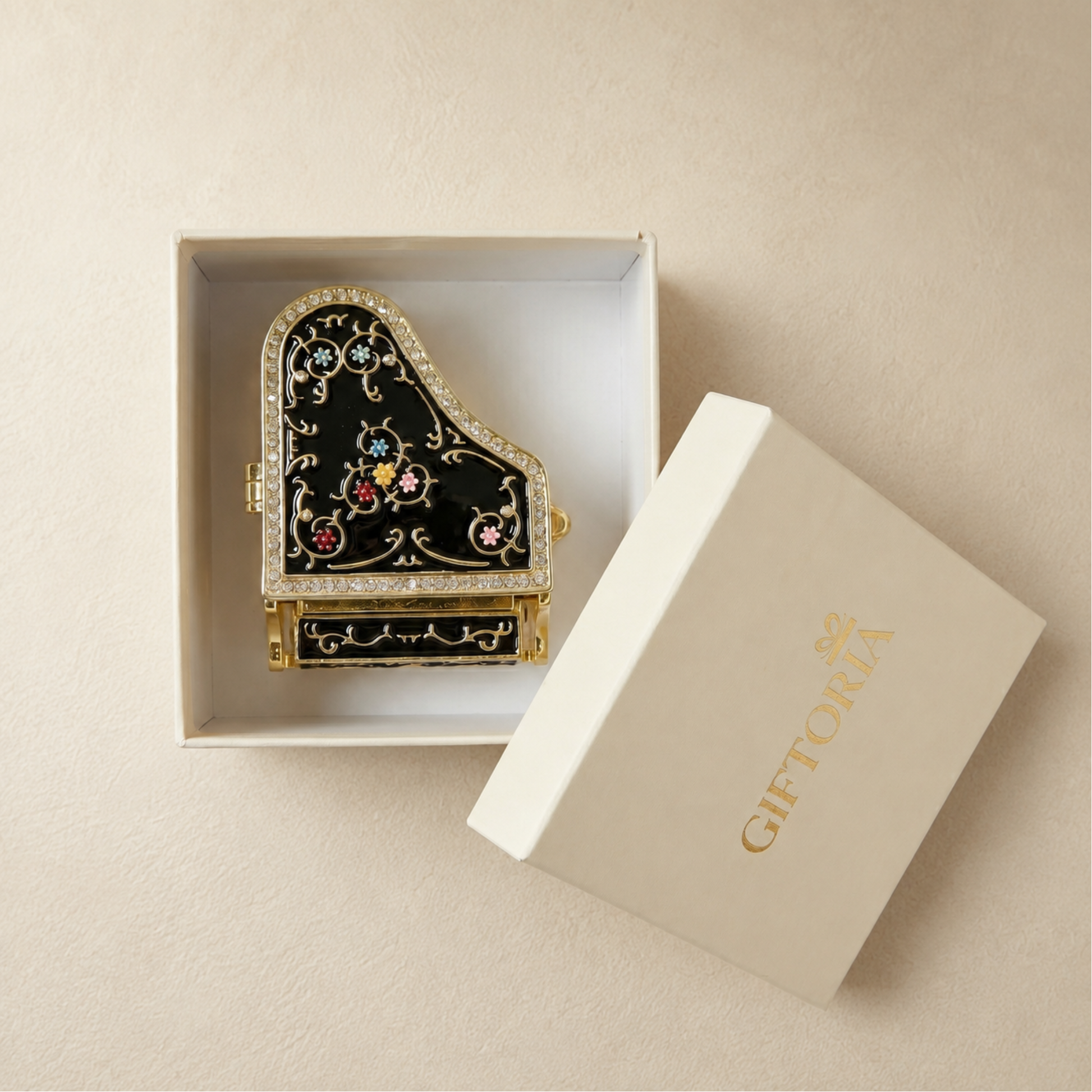 Black grand piano jewellery box presented in Giftoria gift packaging
