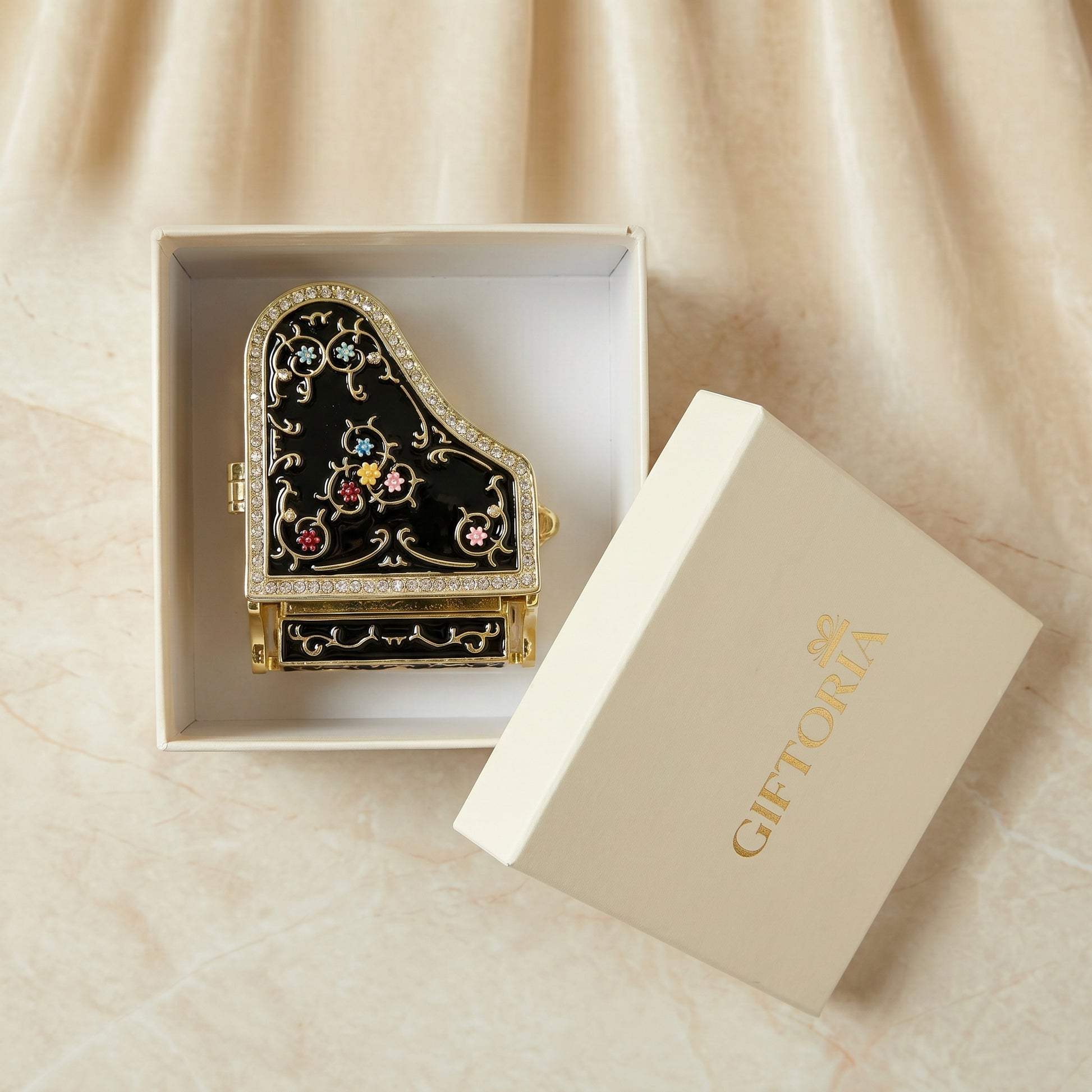 Black piano jewellery box presented in a Giftoria gift box, ready to gift for birthdays, anniversaries and music lovers.