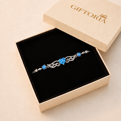 Blue angel wings heart sterling silver bracelet presented in a Giftoria jewellery gift box