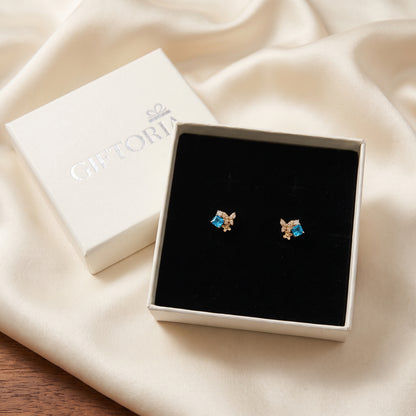 Blue Gold Butterfly Garden stud earrings presented in a Giftoria box