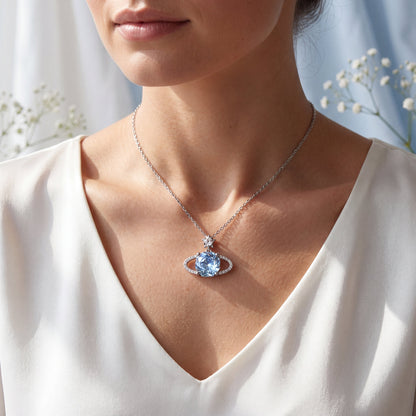 Blue planet sparkling star necklace worn on model with delicate sterling silver chain