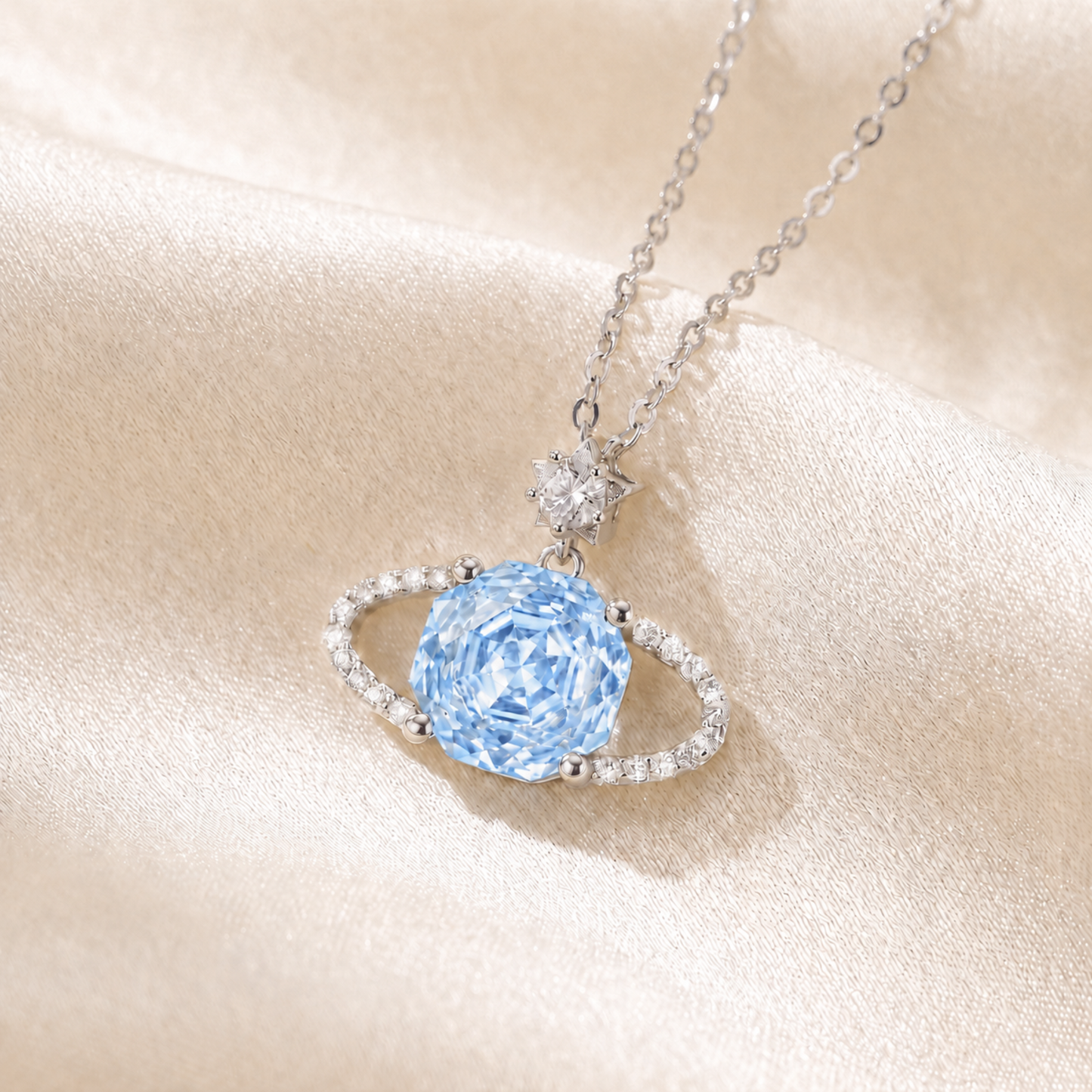 Close-up of Blue Planet star necklace with light blue cubic zirconia and crystal halo