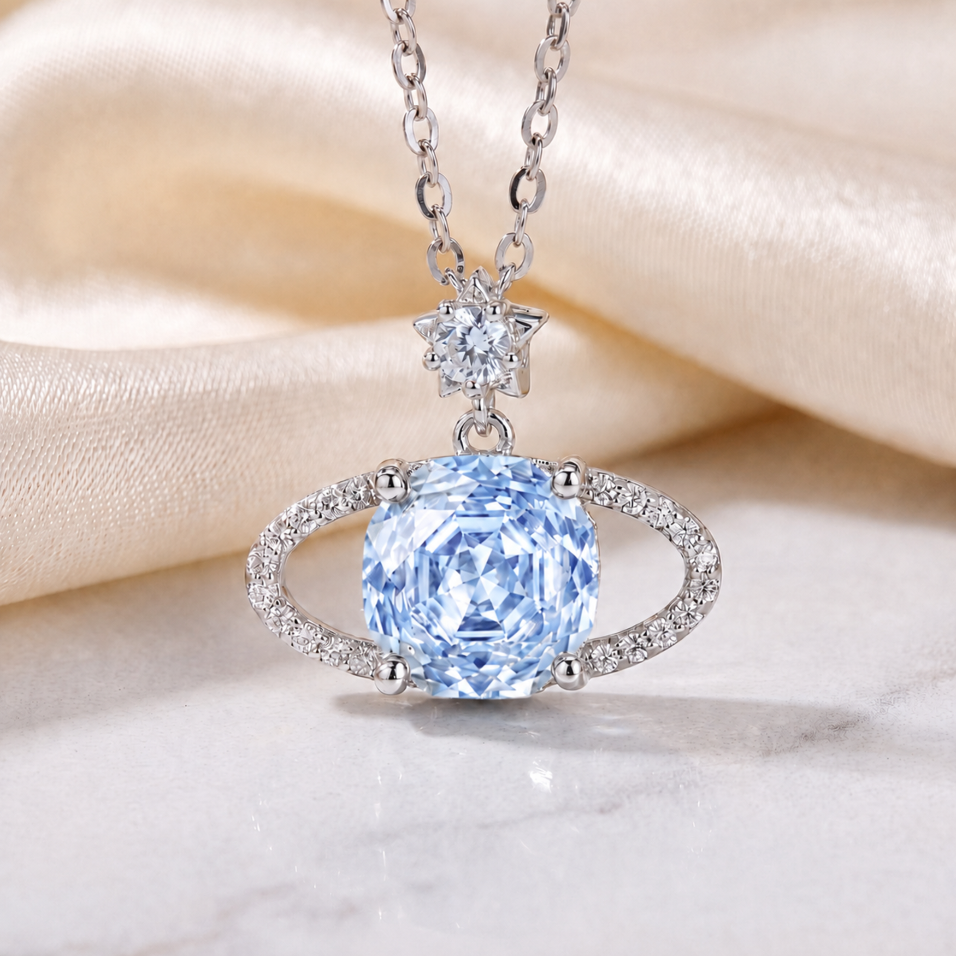 Close-up detail of Blue Planet star pendant necklace with blue cubic zirconia