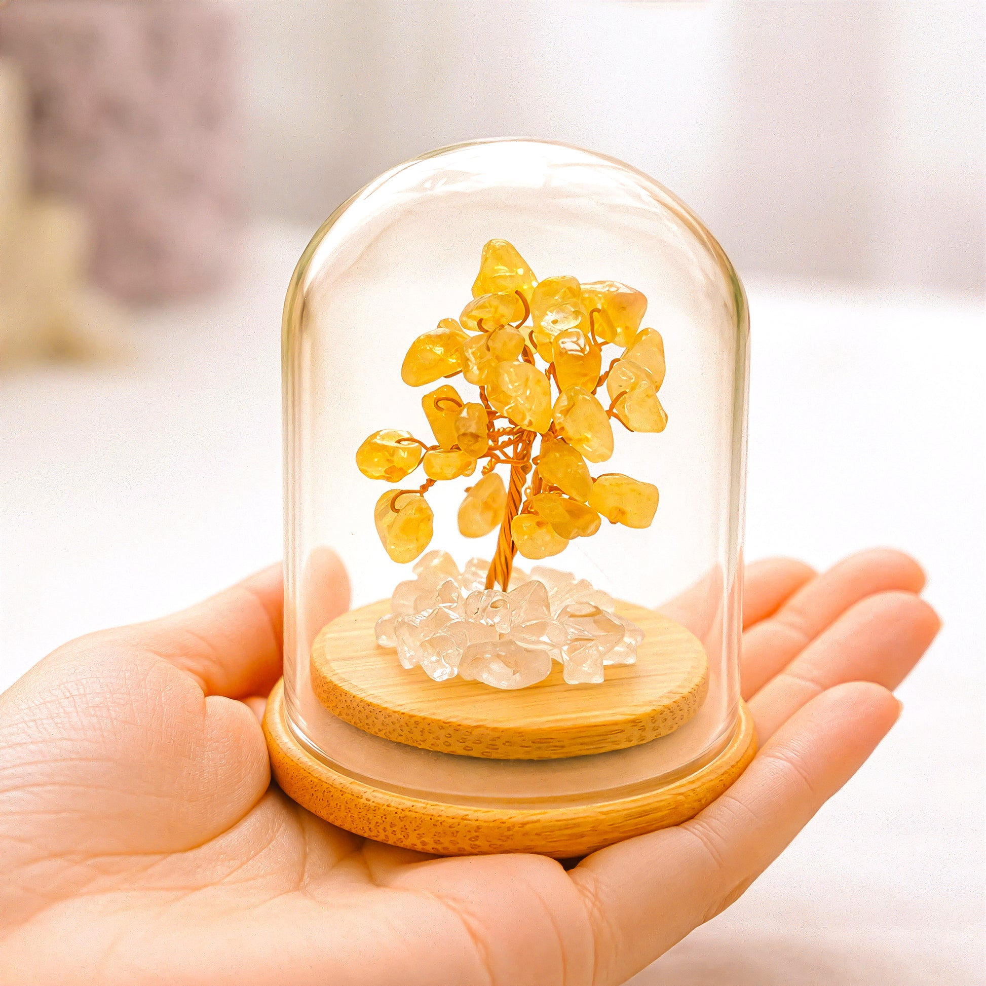Crystal tree for happiness and success shown in hand to display size and detail