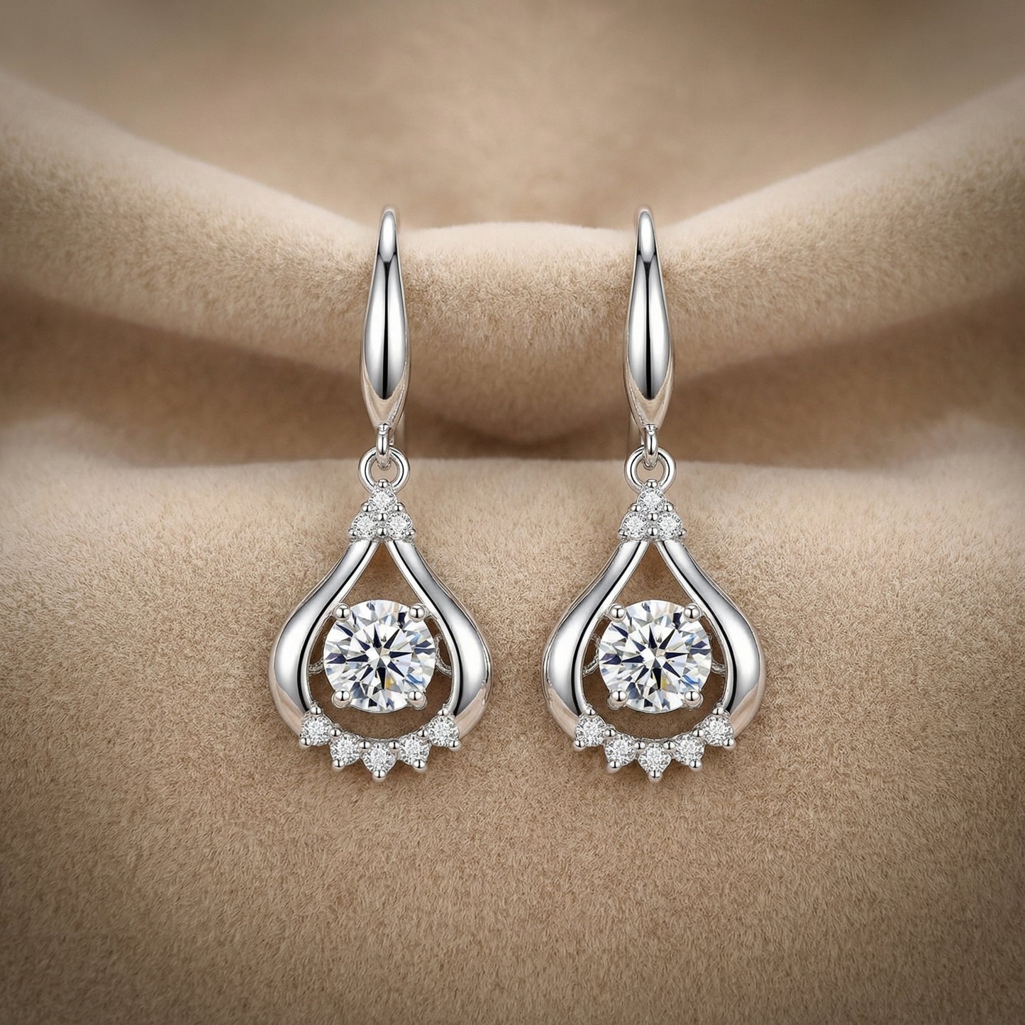 Clear 925 sterling silver teardrop dancing cubic zirconia earrings on soft neutral fabric