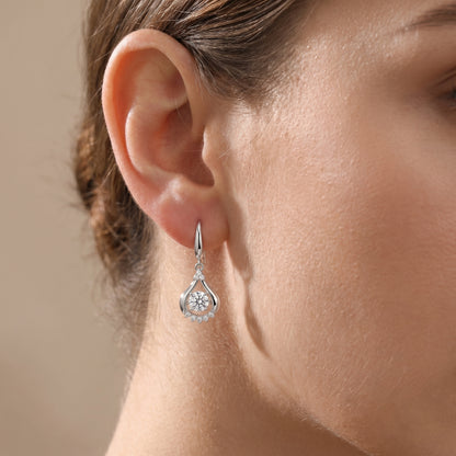 Clear teardrop dancing cubic zirconia earrings worn on ear for an elegant everyday look