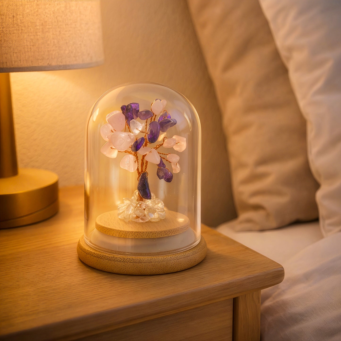 Crystal tree for love and compassion displayed on bedside table with warm light, meaningful home decor gift