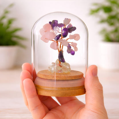 Crystal tree for love and compassion shown in hand to demonstrate size and glass dome detail