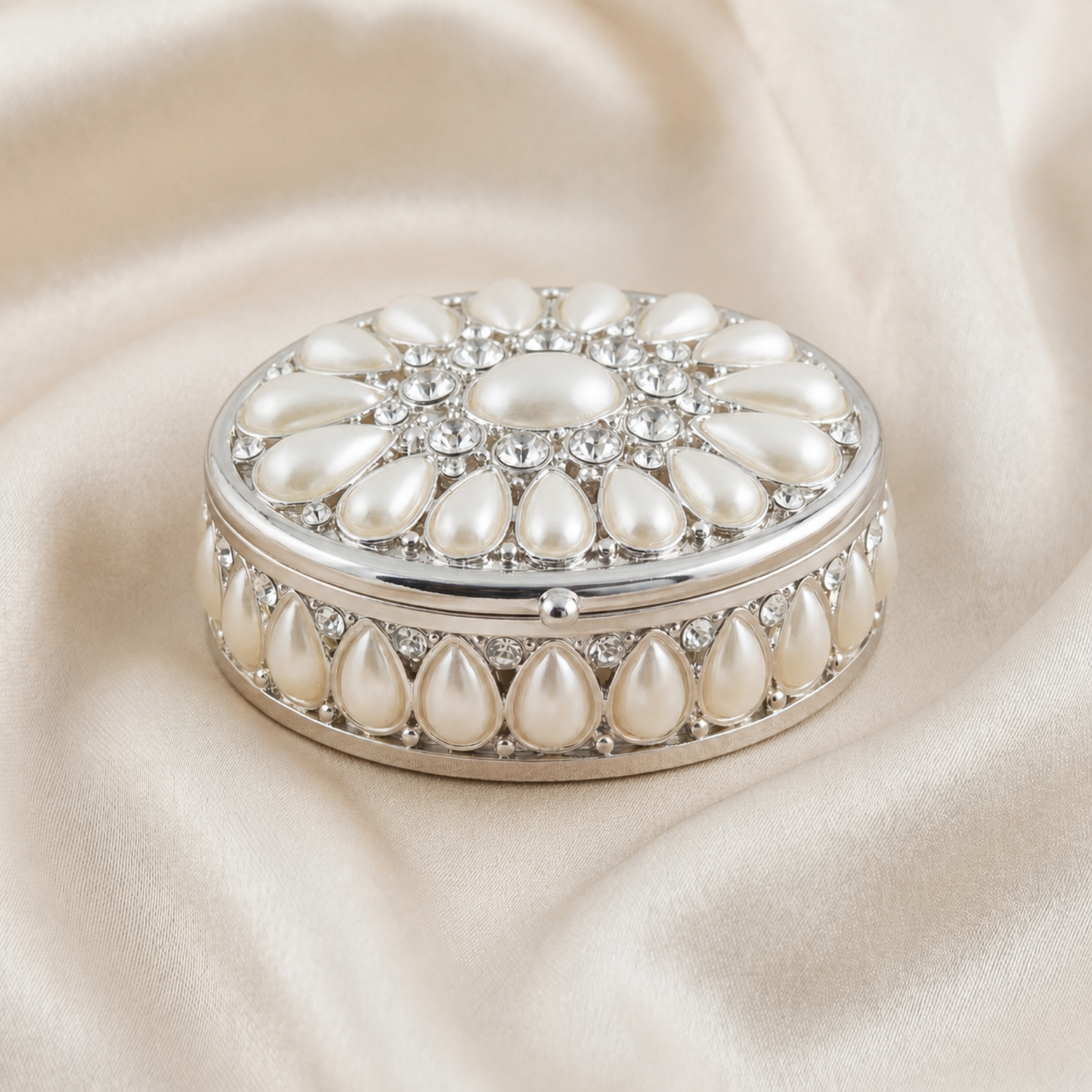 Elegant Pearl Oval Jewellery Box in silver with pearl details on a soft neutral fabric background