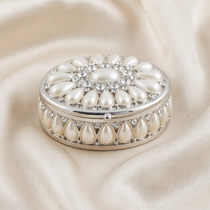 Elegant Pearl Oval Jewellery Box in silver with pearl details on a soft neutral fabric background