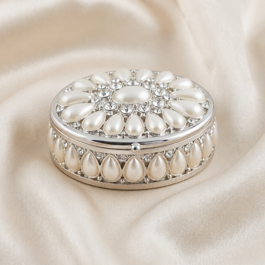 Elegant Pearl Oval Jewellery Box in silver with pearl details on a soft neutral fabric background