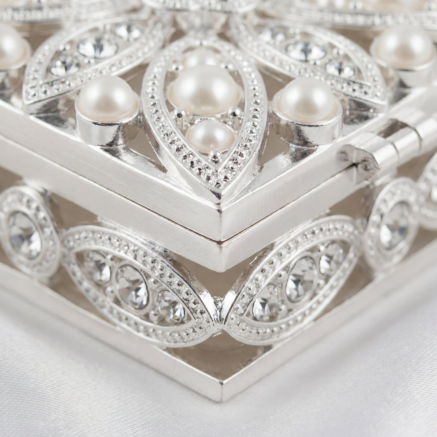 Close-up of the Elegant Pearl Square Jewellery Box showing pearl accents, metal trim and fine craftsmanship