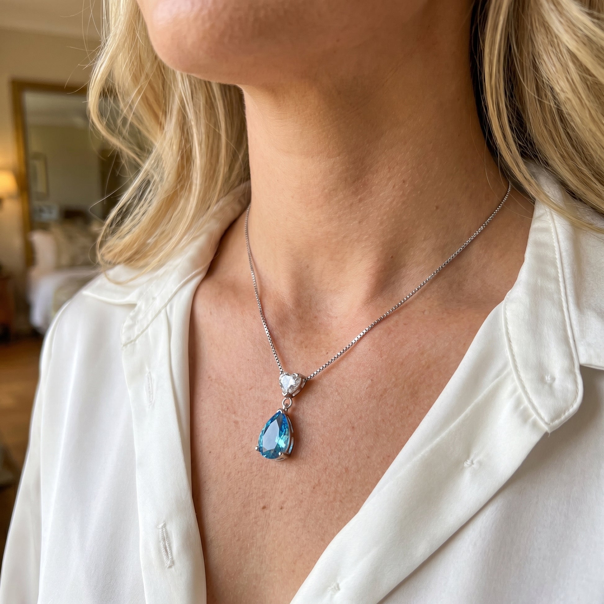 Forever Love 925 sterling silver ocean heart blue necklace worn on model, romantic blue cubic zirconia pendant model wearingAustralia