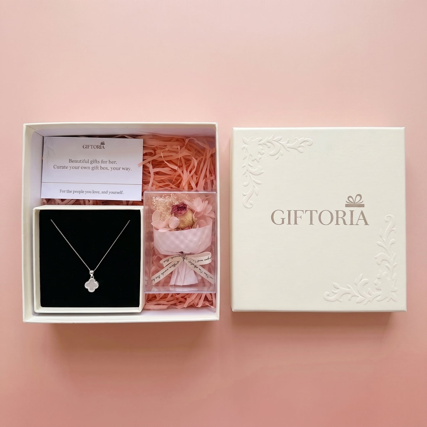 Four leaf clover necklace and dried red rose bouquet presented in a Giftoria gift box