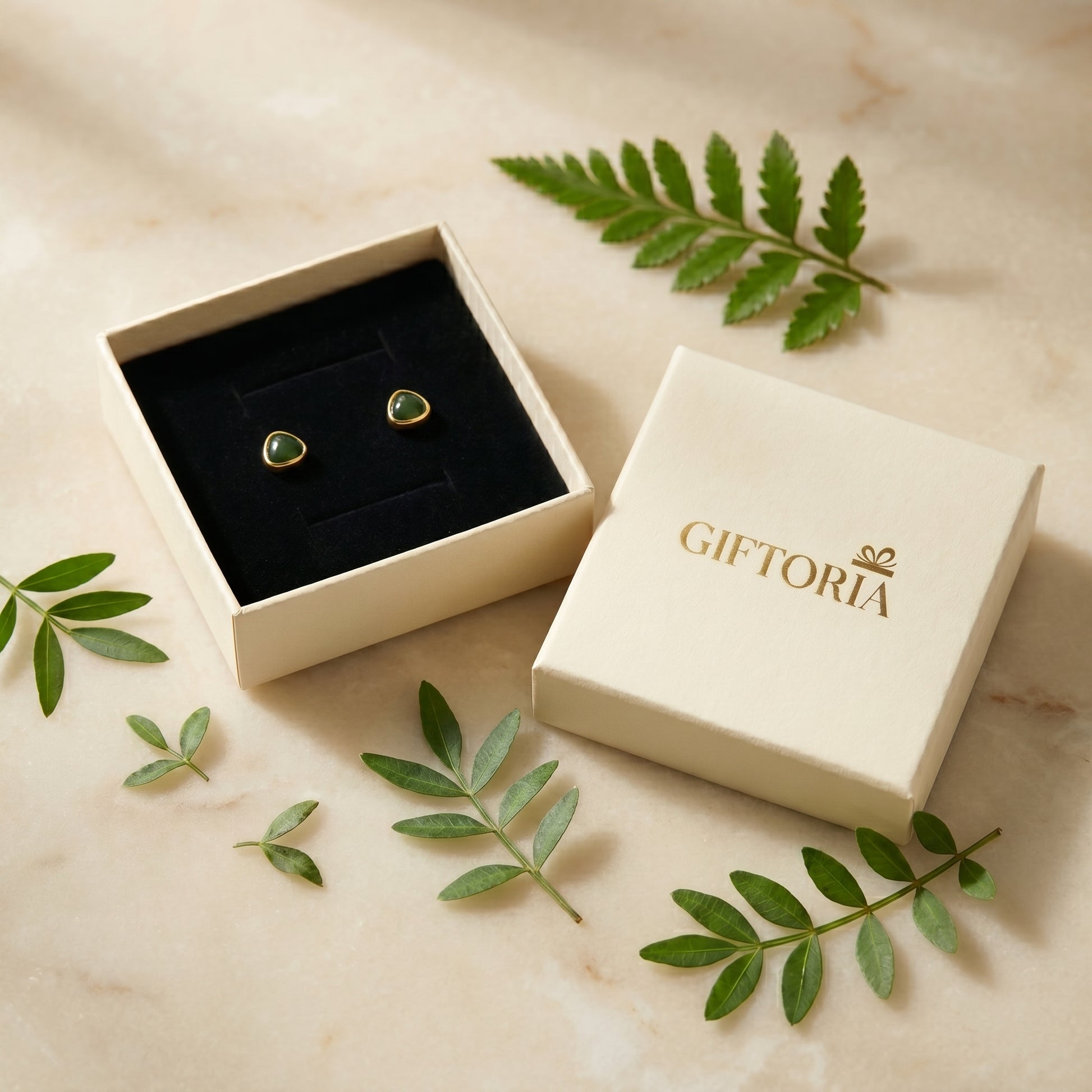 Gift-ready avocado green stud earrings presented in a Giftoria jewellery box
