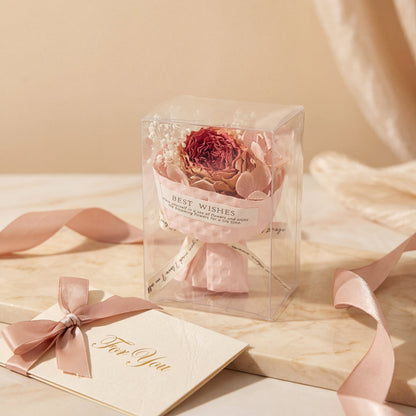 Classic red dried flower bouquet box on soft fabric with envelope, thoughtful gift-ready present for her