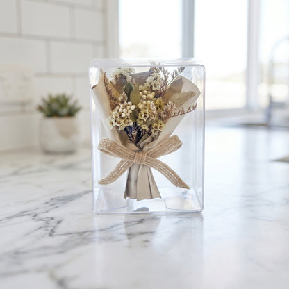 Ivory mixed dried flower bouquet box on table, elegant gift-ready flower arrangement for her