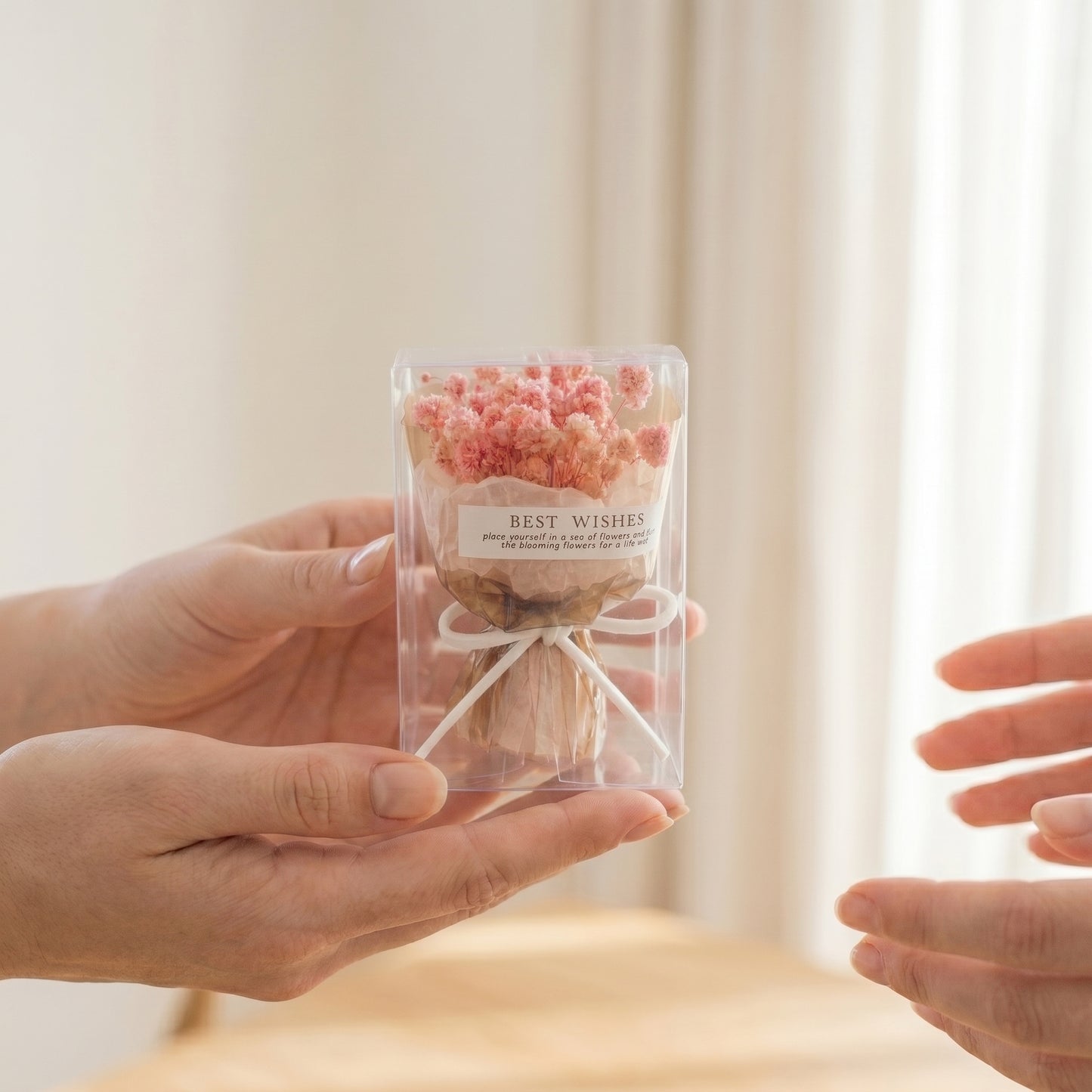 Hand holding pink baby’s breath bouquet box, small gift-ready dried flower arrangement for her