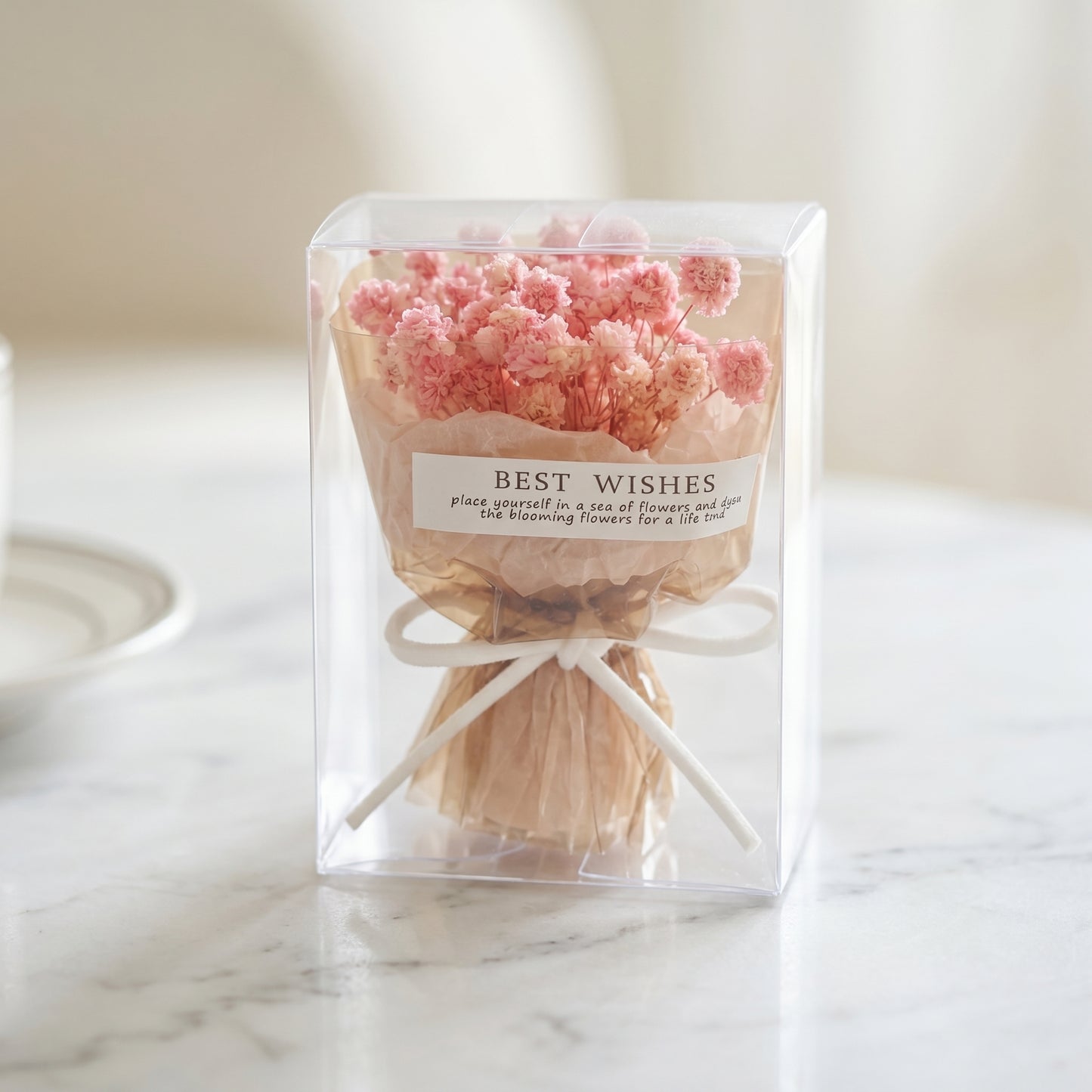 Pink baby’s breath dried flower bouquet box on marble surface, gift-ready floral present for her
