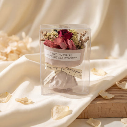 Red rose dried flower bouquet box on cream fabric, romantic ready-to-gift floral keepsake for her