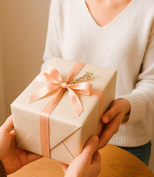 A curated gift being exchanged between two people – Giftoria Australia thoughtful gifting moments