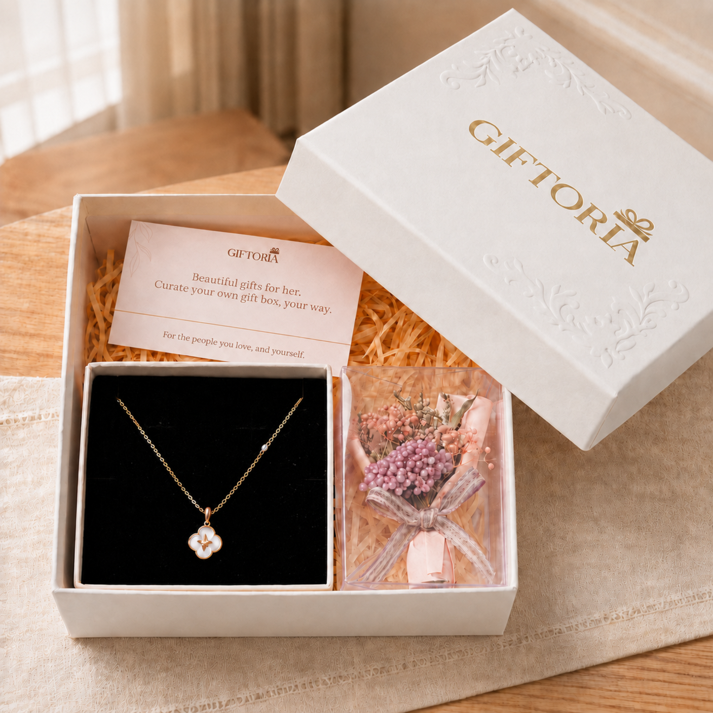 Lucky clover necklace and pink dried flower bouquet beautifully presented in a Giftoria gift box