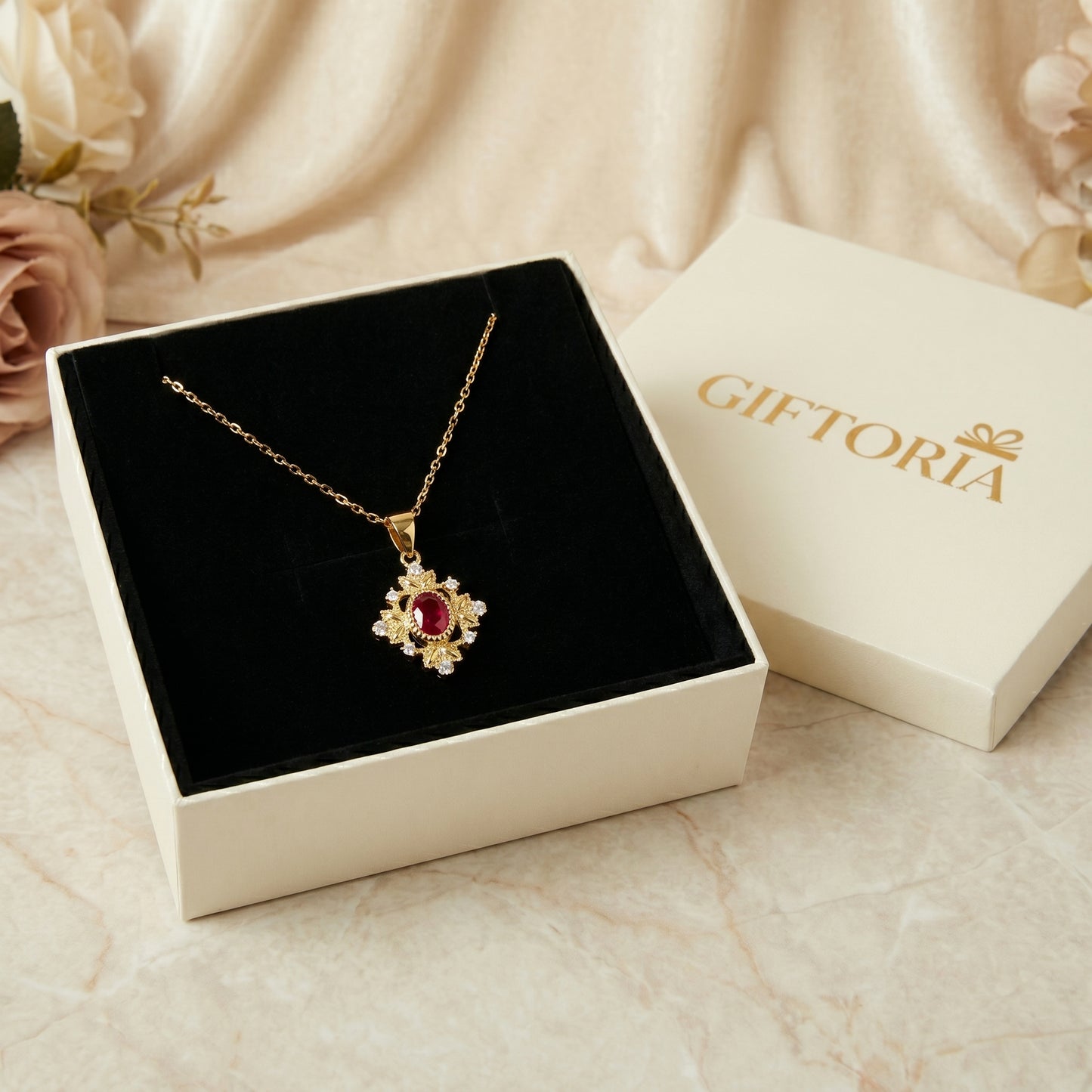 Gold 925 sterling silver ruby red pendant necklace presented in a Giftoria jewellery gift box