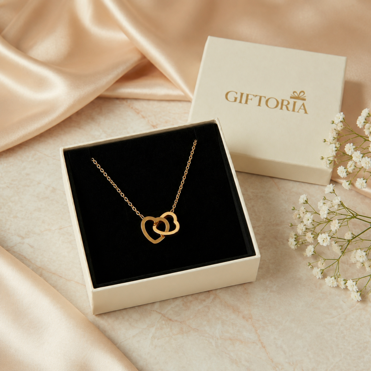 Gold stainless steel double heart necklace presented in a Giftoria jewellery gift box for her