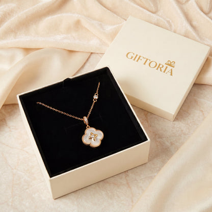 Gold mother of pearl lucky clover necklace presented in a Giftoria gift box