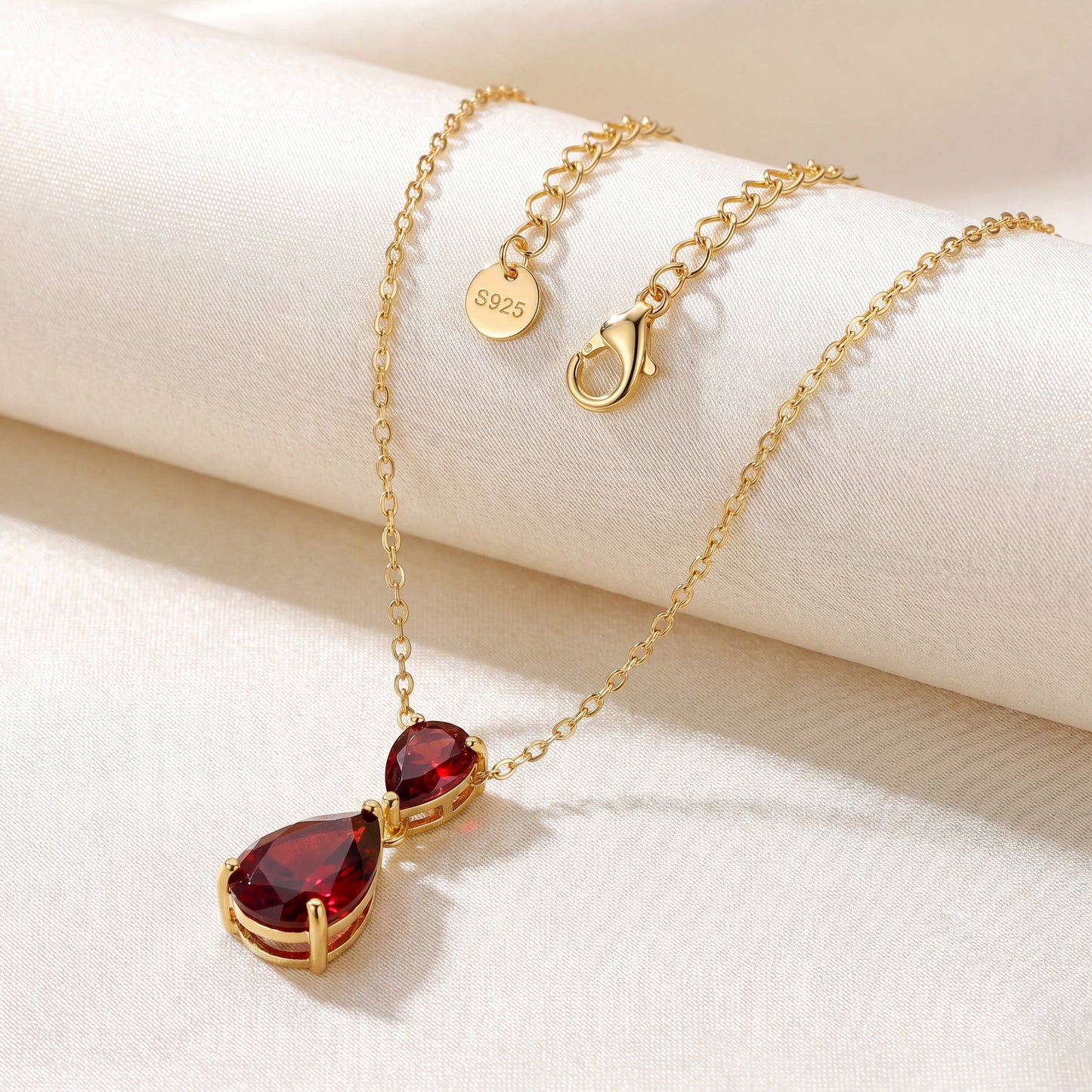 Ruby Glow necklace with gold plated chain clasp and red teardrop pendant