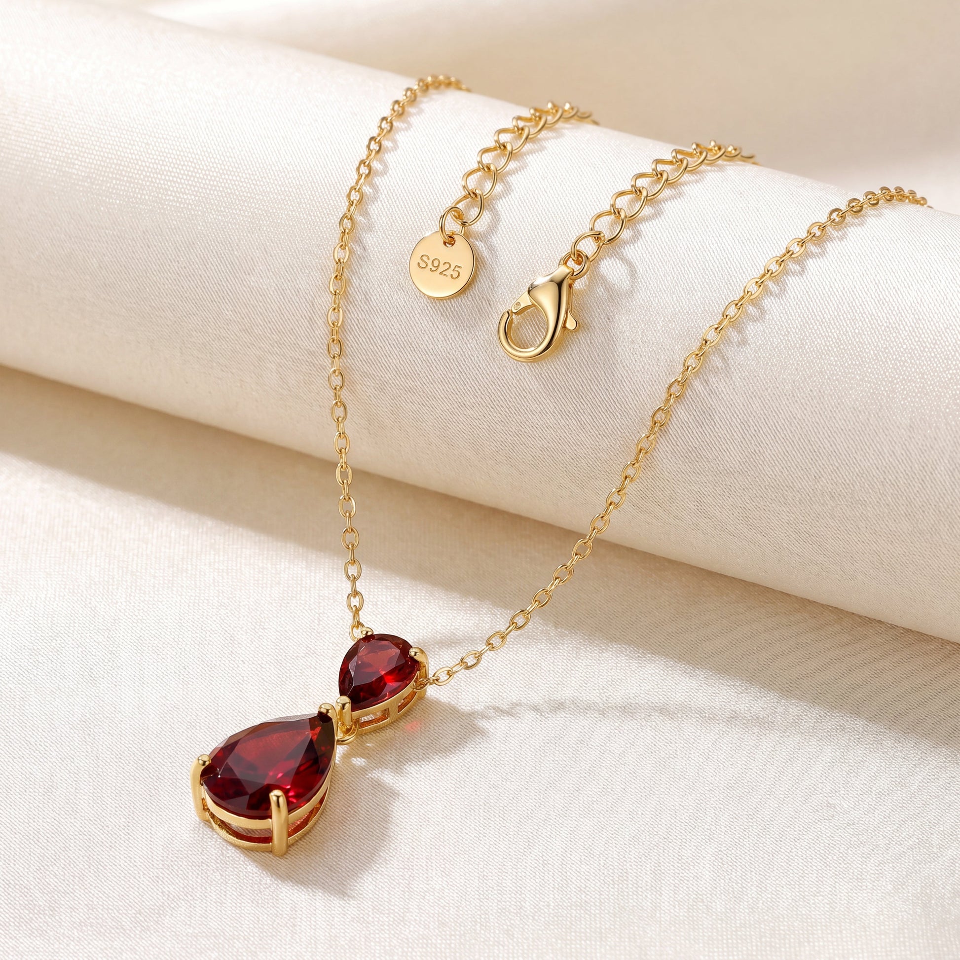Ruby Glow necklace with gold plated chain clasp and red teardrop pendant