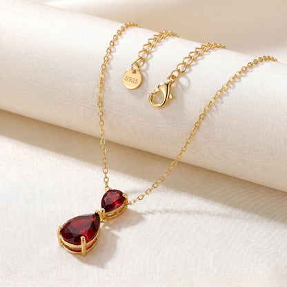 Ruby Glow necklace with gold plated chain clasp and red teardrop pendant