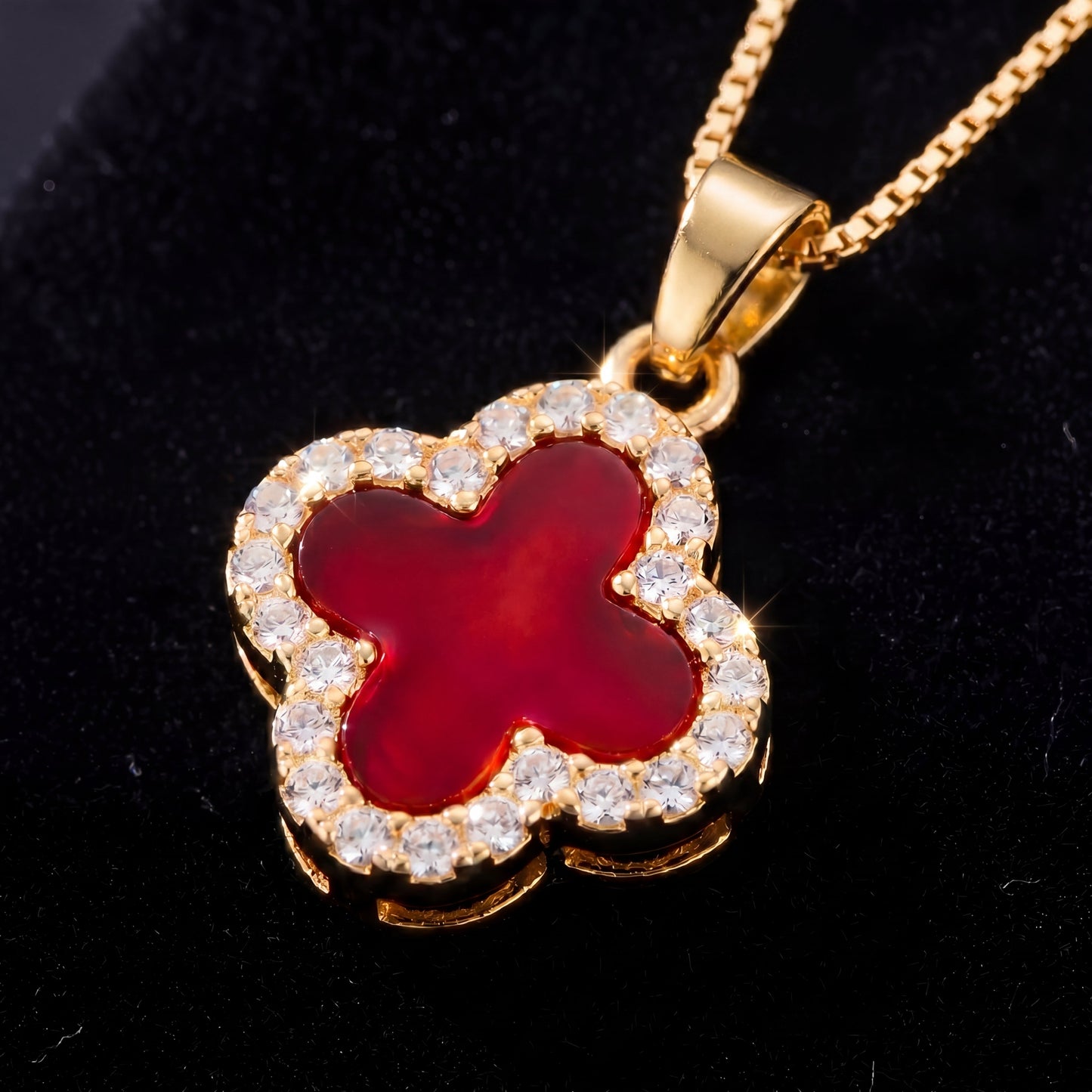 gold red four leaf clover pendant necklace close up